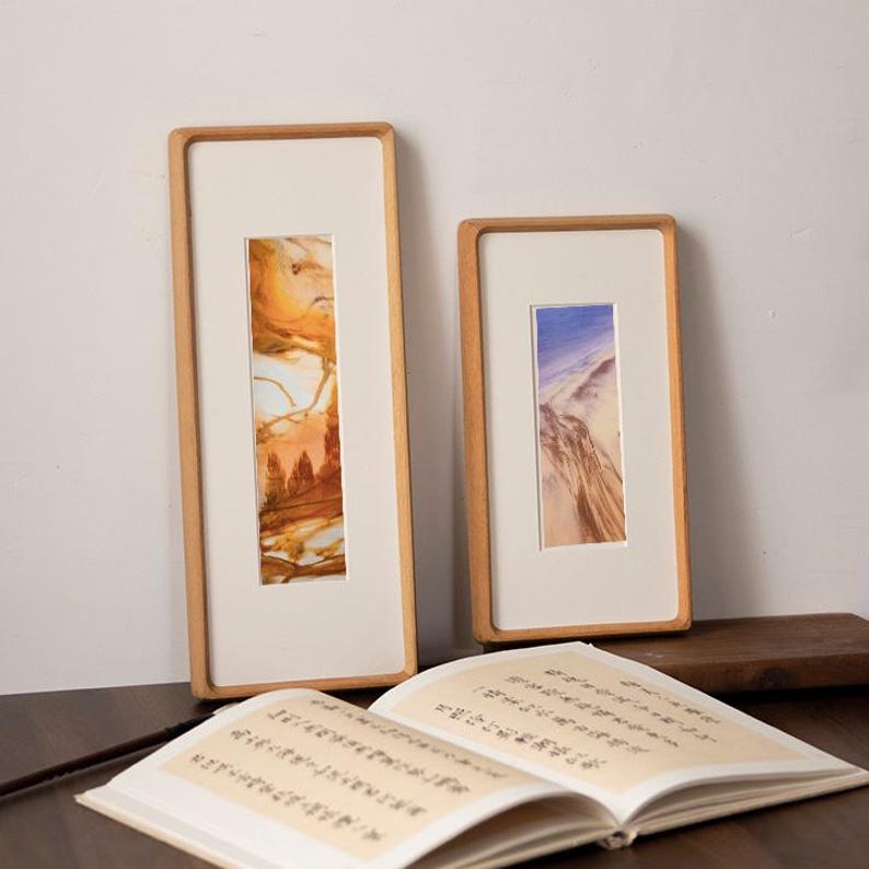 Narrow solid walnut and teak frames, suitable for photo strips, tickets, embossed designs, etc.