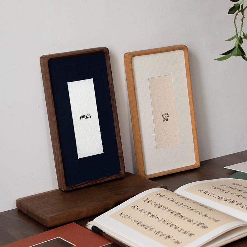 Narrow solid walnut and teak frames, suitable for photo strips, tickets, embossed designs, etc.