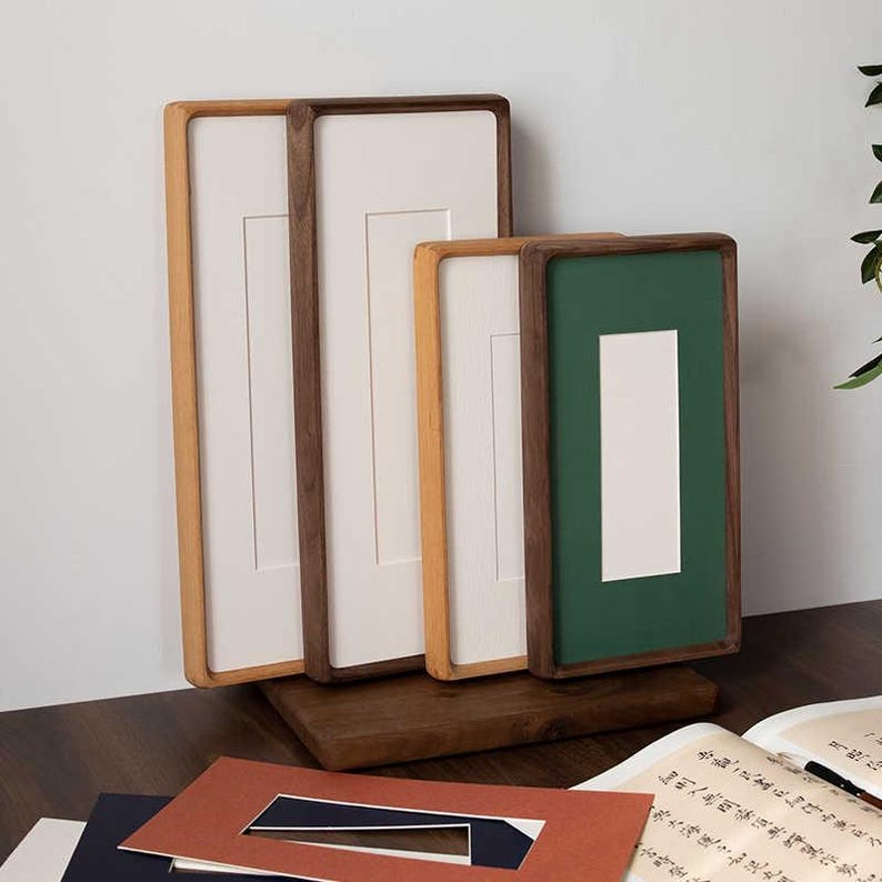 Narrow solid walnut and teak frames, suitable for photo strips, tickets, embossed designs, etc.