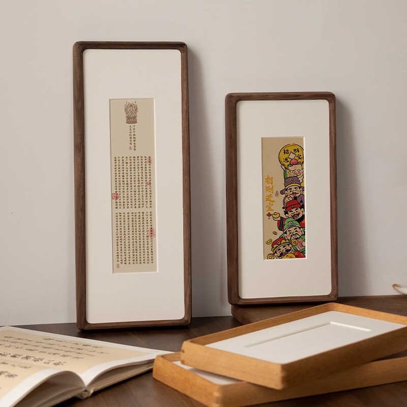 Narrow solid walnut and teak frames, suitable for photo strips, tickets, embossed designs, etc.