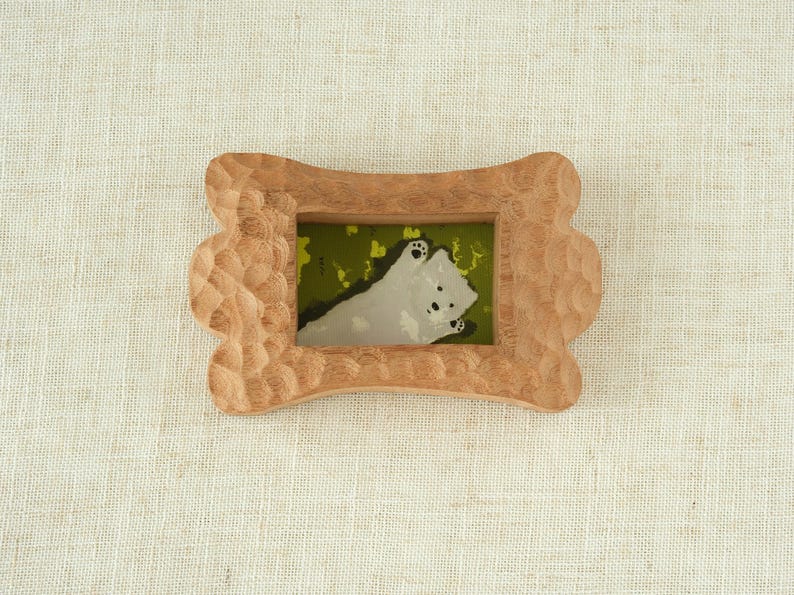 Handcrafted wooden picture frame, with a wavy, irregularly carved dog bone frame, suitable for wall or table decoration.